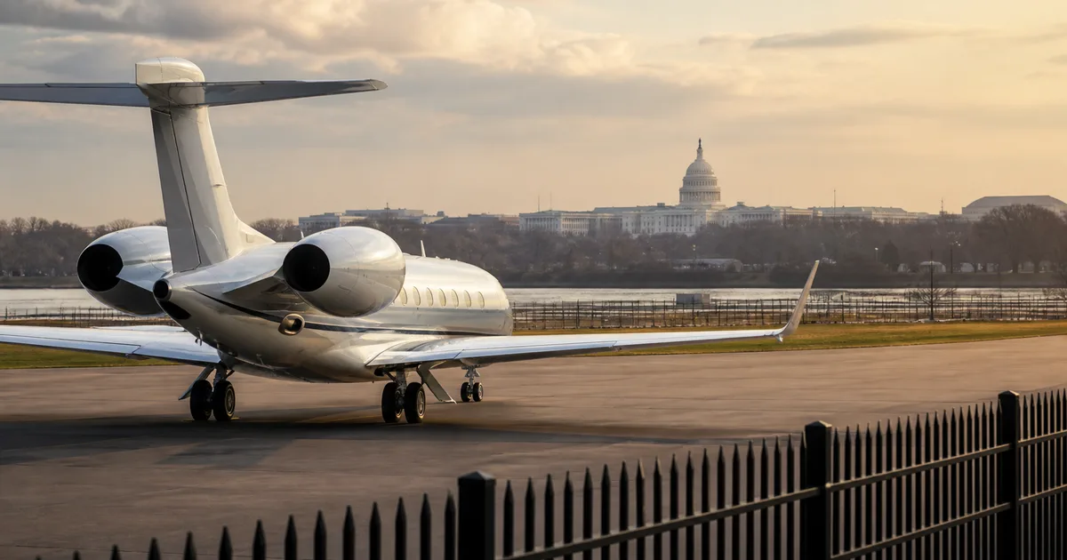 Private aircraft parked with a government building in the distance
